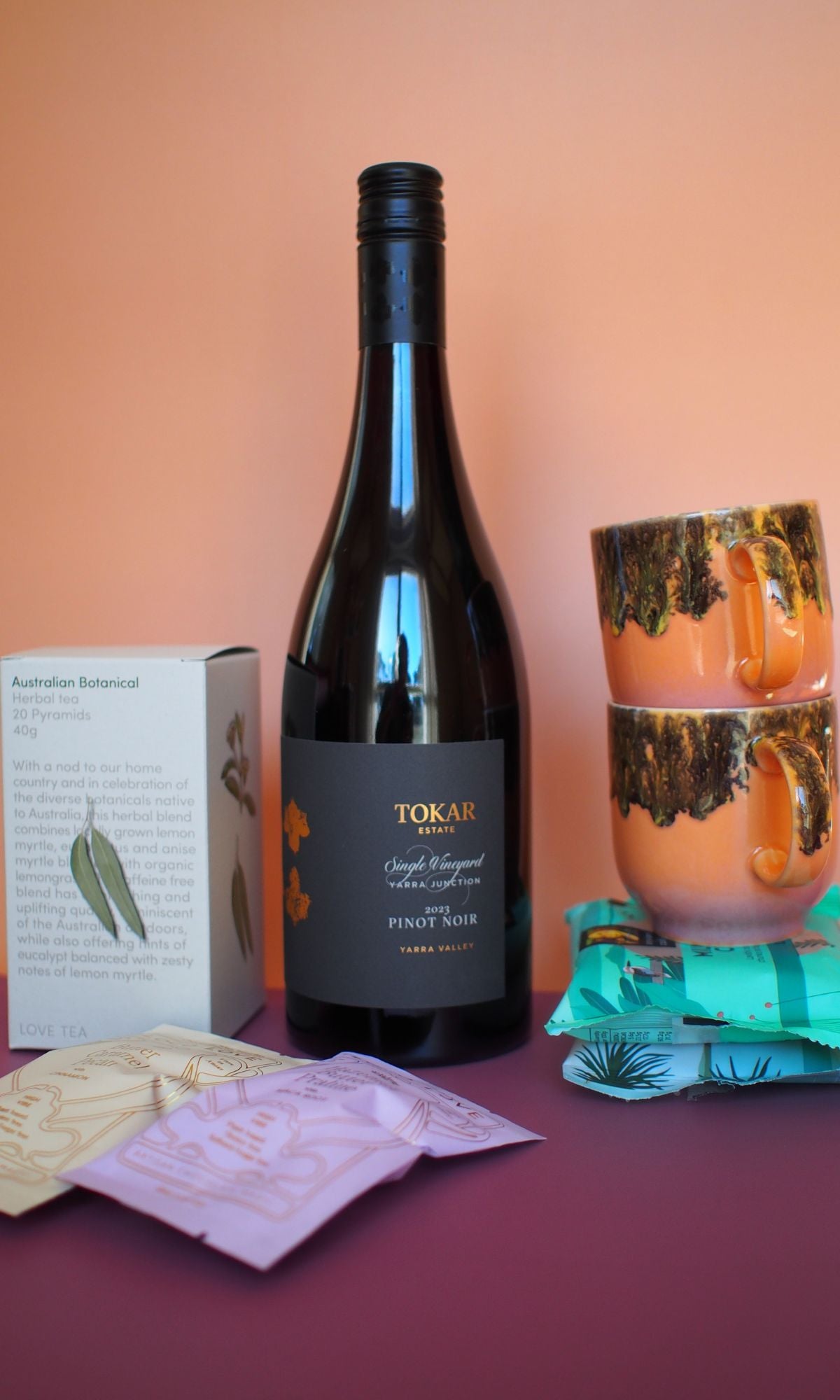 Wine, mugs, chocolates, cookies and teas.