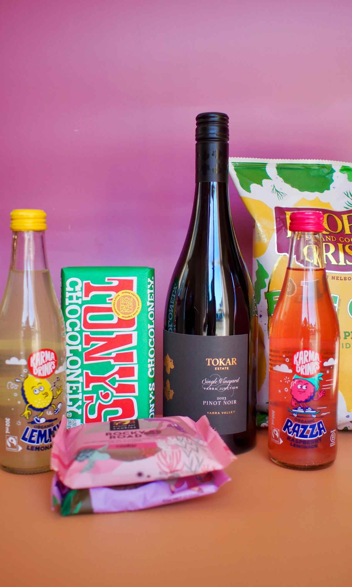Wine, chips, soda, chocolate and cookies.